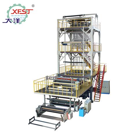 Three layer co-extrusion composite packaging plastic film blowing machine (with upper traction rotation, IBC internal cooling, EPC automatic deviation correction, auto double winding)