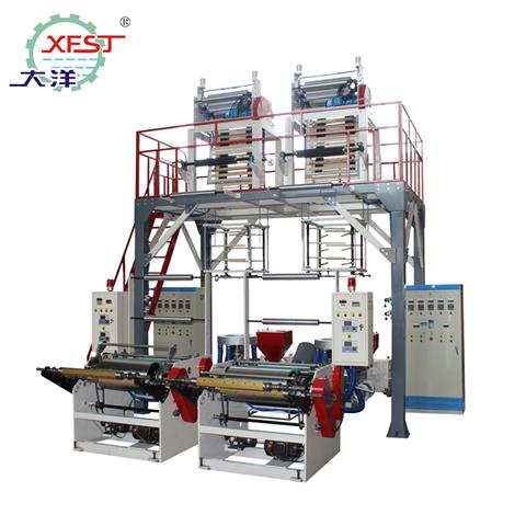 ABA three-layer co-extrusion film blowing machine(with double rotating die head and auto double winding)